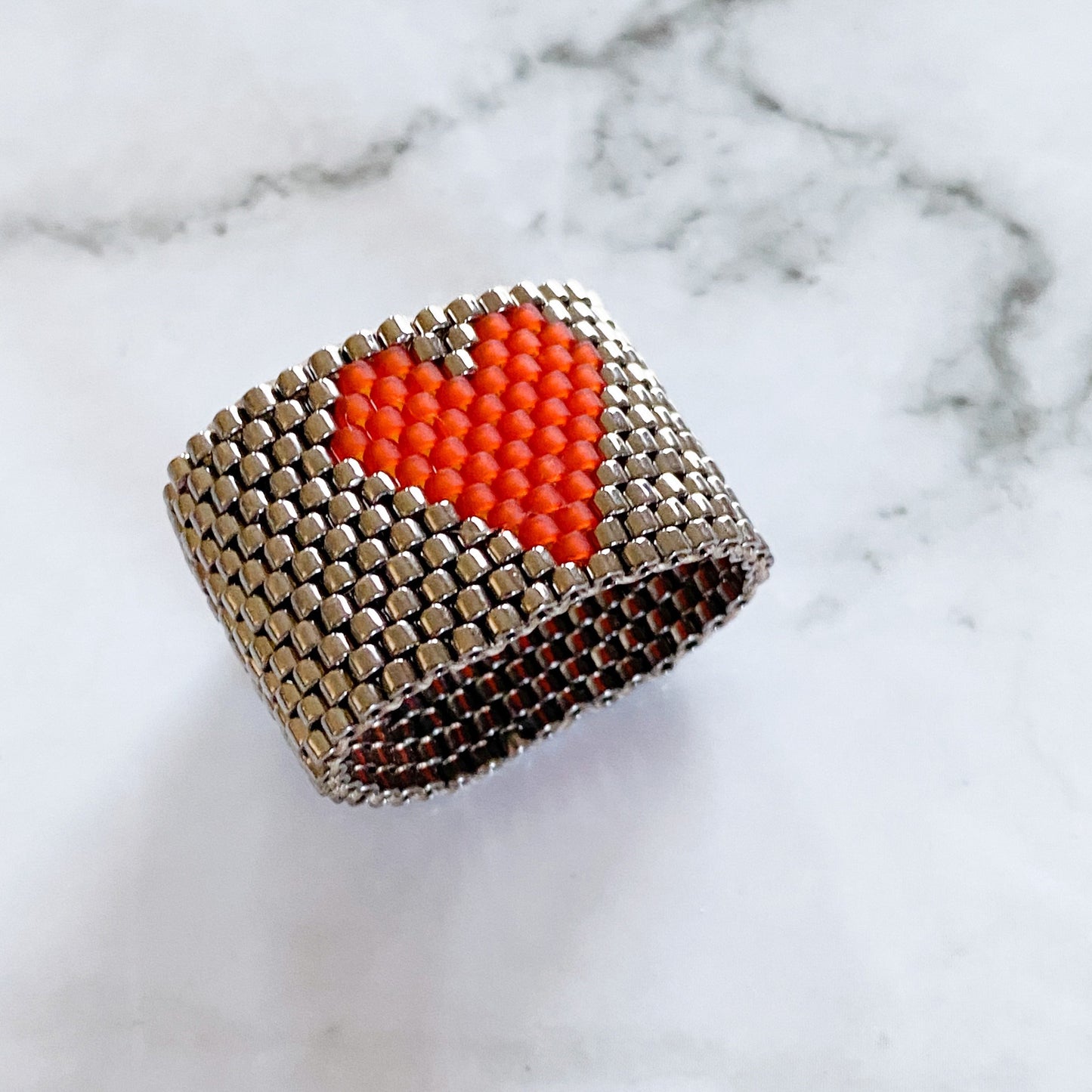 ring with red heart